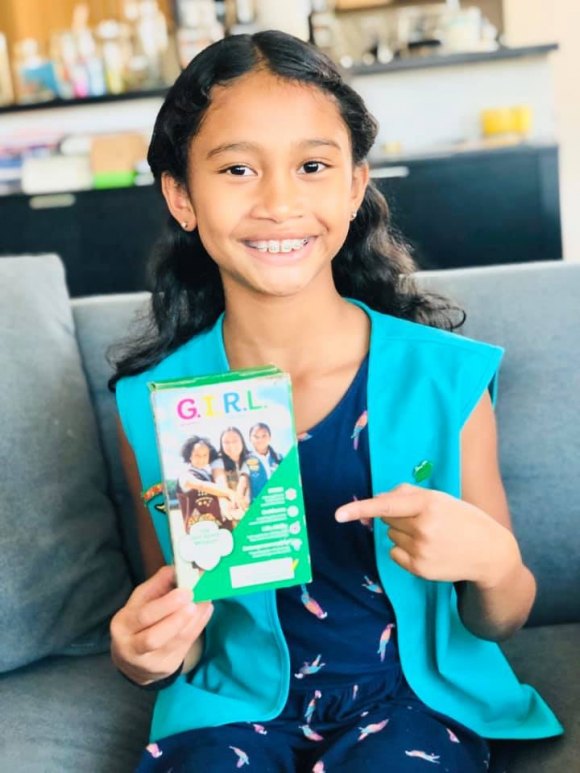 Maya Rodney, Roosevelt Island's Girl Scout Cookies Superstar Maya Rodney shows off the Girl Scout Cookies box with her on the cover.